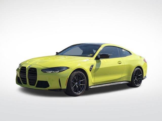 2023 BMW M4 Competition in Sao Paulo Yello — front three-quarter view
